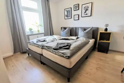 Ein Bett oder Betten in einem Zimmer der Unterkunft Stylish 4ZI Netflix, Kaffeetimer, WIFI, Parken