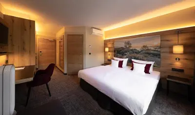 Ein Bett oder Betten in einem Zimmer der Unterkunft Ringhotel Landhaus Nicolai 