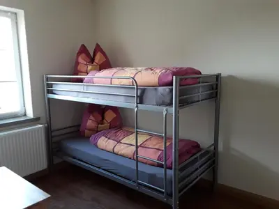 Ein Bett oder Betten in einem Zimmer der Unterkunft Ferienwohnung Radebeul Self Check-in