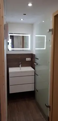Ein Badezimmer in der Unterkunft Traumferienhaus Bergblick Mittelndorf, bis zu 8 Personen, Sauna, Grill