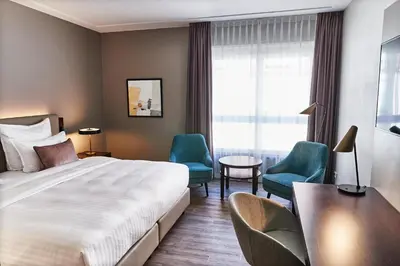 Ein Bett oder Betten in einem Zimmer der Unterkunft Steigenberger Hotel de Saxe