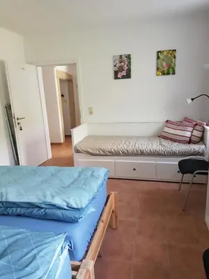 Ein Bett oder Betten in einem Zimmer der Unterkunft Haus Vogelgesang Pirna
