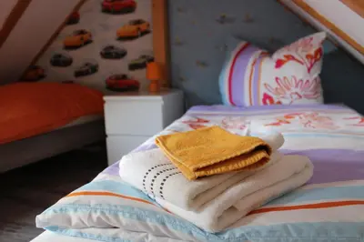 Ein Bett oder Betten in einem Zimmer der Unterkunft Ferienhaus Franz - an der Elbe, mit großem Garten