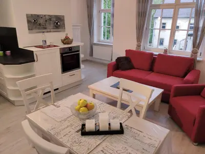 Ein Sitzbereich in der Unterkunft Ferienwohnung Bastei