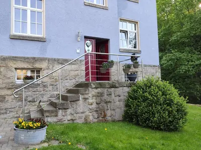 Ein Garten an der Unterkunft Ferienwohnung Bastei