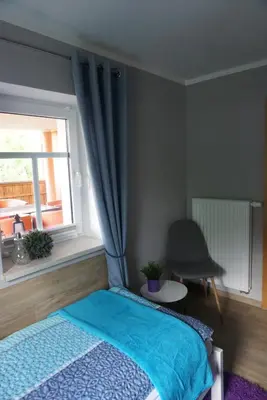 Ein Bett oder Betten in einem Zimmer der Unterkunft Ferienwohnung am Dorfplatz