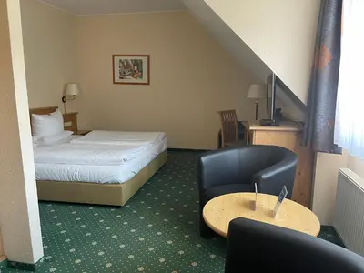 Ein Bett oder Betten in einem Zimmer der Unterkunft Hotel Zum Bären