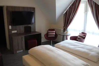 Ein Bett oder Betten in einem Zimmer der Unterkunft Hotel Knorre