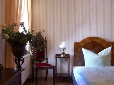 Ein Bett oder Betten in einem Zimmer der Unterkunft Hotel Villa Herzog