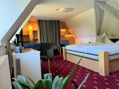 Ein Bett oder Betten in einem Zimmer der Unterkunft Berghotel Talblick