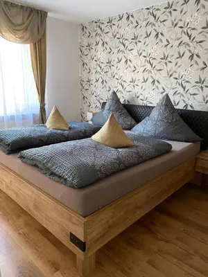 Ein Bett oder Betten in einem Zimmer der Unterkunft Apartment Saxonia