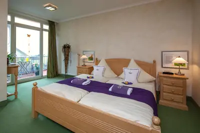 Ein Bett oder Betten in einem Zimmer der Unterkunft Gästehaus am Markt - Leisnig