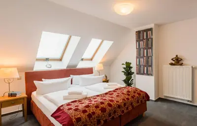 Ein Bett oder Betten in einem Zimmer der Unterkunft Apparthotel Bad Schandau by STEIGER Hotels