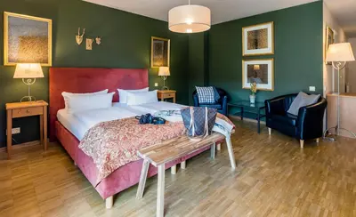 Ein Bett oder Betten in einem Zimmer der Unterkunft Apparthotel Bad Schandau by STEIGER Hotels