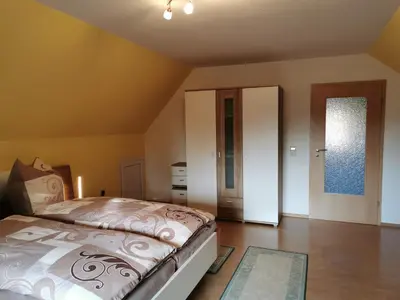 Ein Bett oder Betten in einem Zimmer der Unterkunft Ferienhaus Rosenhof