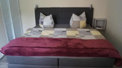 Ein Bett oder Betten in einem Zimmer der Unterkunft Sandsteinperle