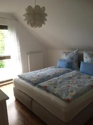 Ein Bett oder Betten in einem Zimmer der Unterkunft Ferienwohnung Luna - [#a43787]
