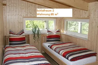 Ein Bett oder Betten in einem Zimmer der Unterkunft Ferienwohnung Gohrisch Ambiente