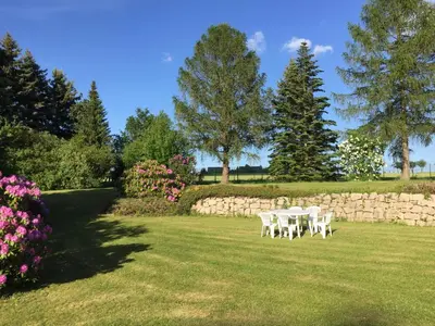 Ein Garten an der Unterkunft Hotel am Kunnerstein