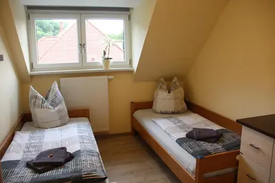 Ein Bett oder Betten in einem Zimmer der Unterkunft Ferienwohnung Pirna - [#a44102]