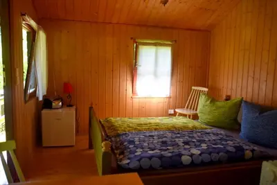 Ein Bett oder Betten in einem Zimmer der Unterkunft Sommerhaus Bella Vita
