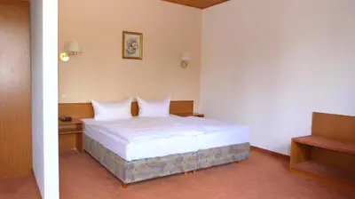 Ein Bett oder Betten in einem Zimmer der Unterkunft Hotel Mühlenhof