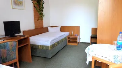 Ein Bett oder Betten in einem Zimmer der Unterkunft Hotel Mühlenhof