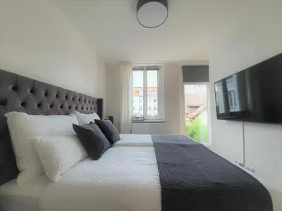 Ein Bett oder Betten in einem Zimmer der Unterkunft PB Ferienwohnungen - FeWo 4 - Stilvoll eingerichtetes Studio im Herzen Senftenbergs