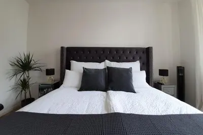 Ein Bett oder Betten in einem Zimmer der Unterkunft PB Ferienwohnungen - FeWo 4 - Stilvoll eingerichtetes Studio im Herzen Senftenbergs