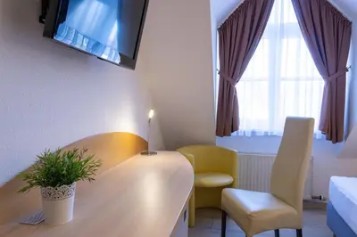 Ein Sitzbereich in der Unterkunft Hotel Alte Mühle