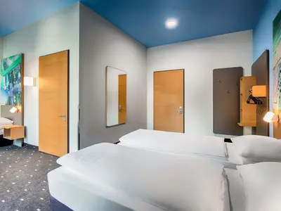 Ein Bett oder Betten in einem Zimmer der Unterkunft B&B Hotel Chemnitz