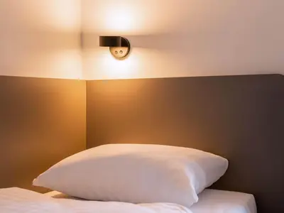 Ein Bett oder Betten in einem Zimmer der Unterkunft B&B Hotel Chemnitz