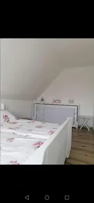 Ein Bett oder Betten in einem Zimmer der Unterkunft Ferienhaus Rosmarie am Elbradweg