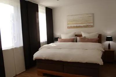 Ein Bett oder Betten in einem Zimmer der Unterkunft Luxuriöse Stadtwohnungen in Königstein