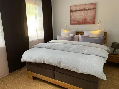 Ein Bett oder Betten in einem Zimmer der Unterkunft Luxuriöse Stadtwohnungen in Königstein