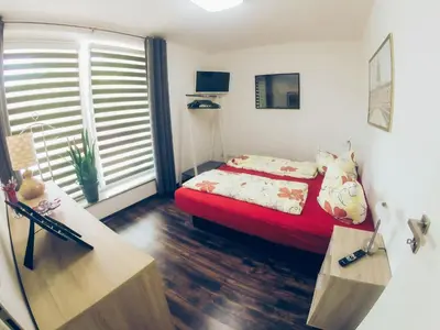 Ein Bett oder Betten in einem Zimmer der Unterkunft Ferienwohnung
