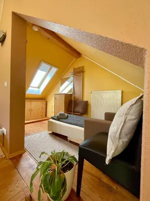 Ein Bett oder Betten in einem Zimmer der Unterkunft STUDIO am Kaitzer Weinberg