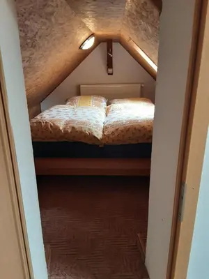 Ein Bett oder Betten in einem Zimmer der Unterkunft Ferienwohnung auf den Bauernhof