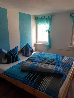 Ein Bett oder Betten in einem Zimmer der Unterkunft Ferienwohnung Willkommen