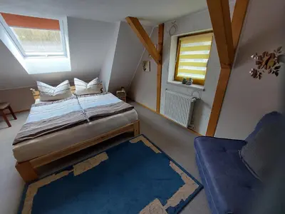 Ein Bett oder Betten in einem Zimmer der Unterkunft Ferienwohnung Morgensonne Kurort Rathen