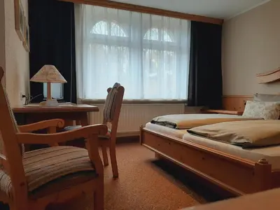 Ein Bett oder Betten in einem Zimmer der Unterkunft Restaurant & Hotel Zur Falkenhöhe