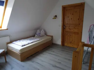Ein Bett oder Betten in einem Zimmer der Unterkunft Ferienhaus Dampferblick