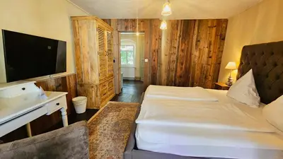 Ein Bett oder Betten in einem Zimmer der Unterkunft Boutique-Hotel & Wellness Goldenes Fass Meißen