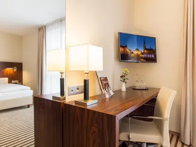 Ein Bett oder Betten in einem Zimmer der Unterkunft Hotel an der Oper
