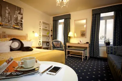 Ein Bett oder Betten in einem Zimmer der Unterkunft Sebnitzer Hof by STEIGER Hotels