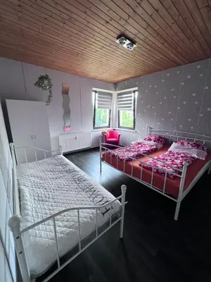 Ein Bett oder Betten in einem Zimmer der Unterkunft Ferienwohnung Bella in Heidenau bei Dresden