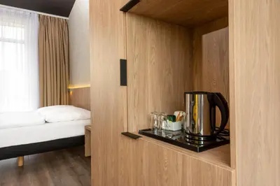 Ein Bett oder Betten in einem Zimmer der Unterkunft ibis Styles Dresden Neustadt