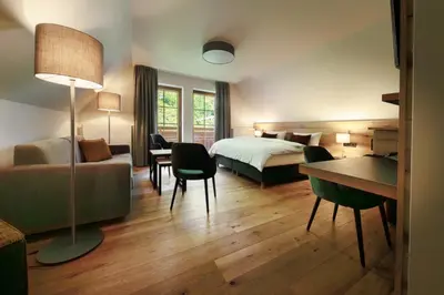 Ein Bett oder Betten in einem Zimmer der Unterkunft Hotel Amselgrundschlößchen