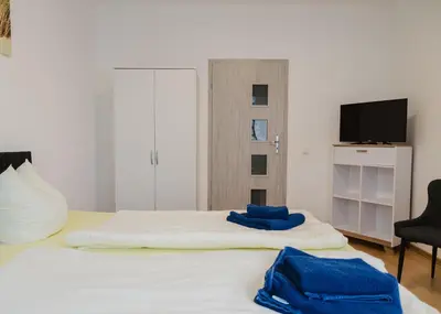 Ein Bett oder Betten in einem Zimmer der Unterkunft Apartmenthaus Sternstraße 6