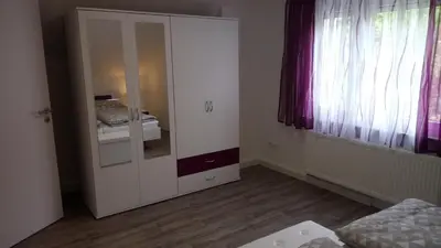 Ein Bett oder Betten in einem Zimmer der Unterkunft Haus Waldidyll